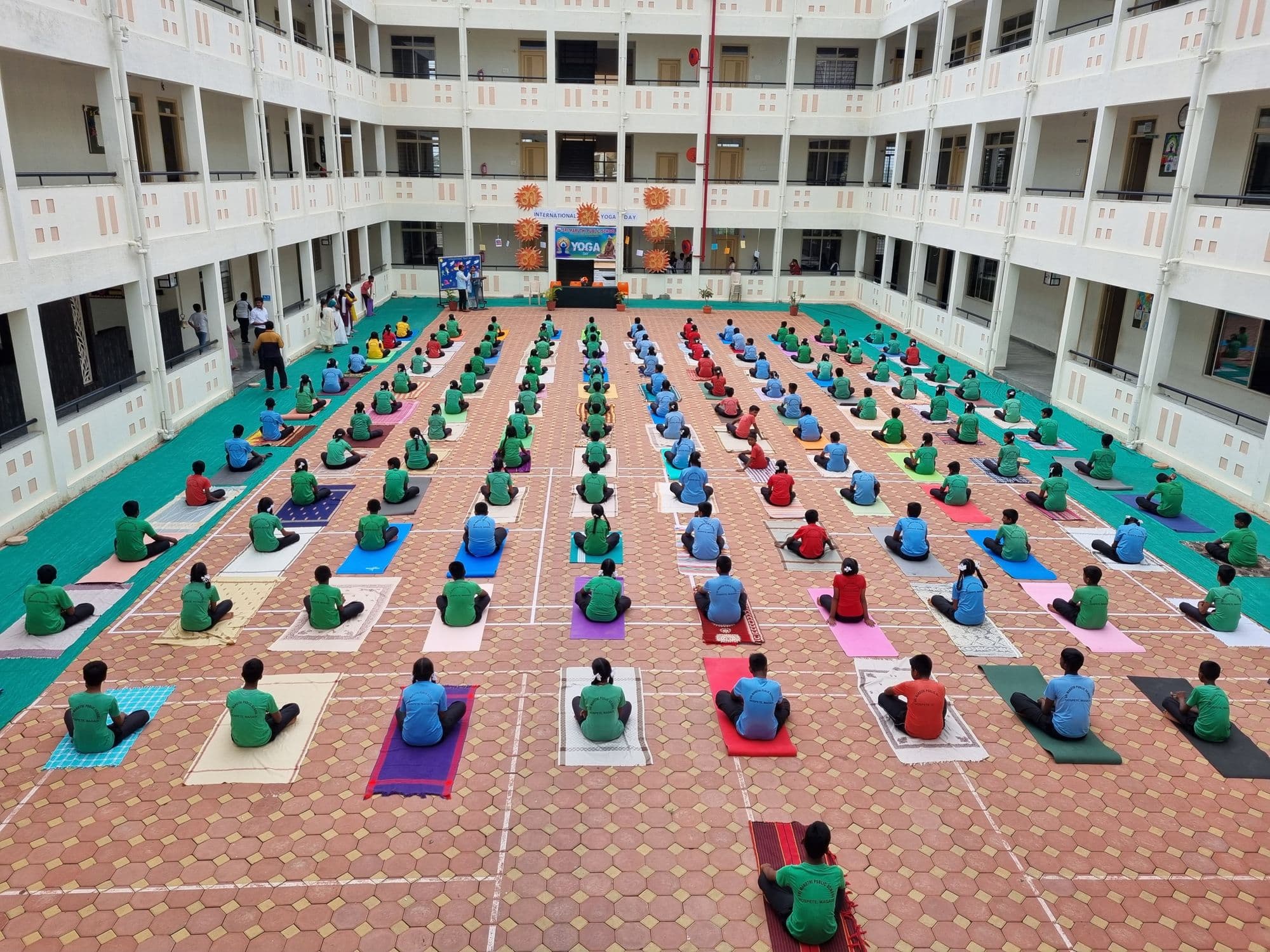 Students practising yoga together on Yoga Day